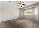 Spacious main bedroom features a ceiling fan, carpet flooring, and natural light at 18719 E Pelican Ct, Queen Creek, AZ 85142