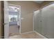 Bathroom featuring a clear glass shower and a view into the carpeted bedroom at 19667 N 260Th N Ln, Buckeye, AZ 85396