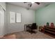 Well-lit bedroom featuring neutral walls and a dedicated workspace at 19667 N 260Th N Ln, Buckeye, AZ 85396
