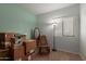 Well-lit bedroom featuring carpeted floors and ample natural light from the window at 19667 N 260Th N Ln, Buckeye, AZ 85396