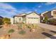 Lovely single-story home boasting a two-car garage and attractive desert landscaping at 19667 N 260Th N Ln, Buckeye, AZ 85396