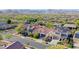 Expansive aerial view of a community showcasing neighborhood homes and a mountain vista at 20510 W White Rock Rd, Buckeye, AZ 85396