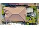 Aerial view of a house featuring a terracotta tile roof, outdoor pergola, and artificial grass at 20510 W White Rock Rd, Buckeye, AZ 85396