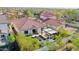 Aerial view showcasing a backyard with artificial grass, a pergola, and lush landscaping at 20510 W White Rock Rd, Buckeye, AZ 85396
