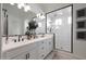 Bright bathroom featuring double vanity, glass shower, and updated tile at 20510 W White Rock Rd, Buckeye, AZ 85396
