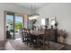 The dining room has a rustic table, with sliding glass doors leading to the outdoor area at 20510 W White Rock Rd, Buckeye, AZ 85396