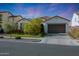 Charming single-story home boasting a well-manicured lawn, desert landscaping, and a two-car garage at 20510 W White Rock Rd, Buckeye, AZ 85396