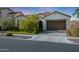 Picture of the front of a home that features a terracotta roof and well-kept lawn at 20510 W White Rock Rd, Buckeye, AZ 85396
