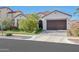 Charming single-story home with a well-manicured lawn, tile roof, and a two-car garage at 20510 W White Rock Rd, Buckeye, AZ 85396