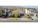 Inviting single-story home with a tile roof, lush front yard, and mountain views at 20510 W White Rock Rd, Buckeye, AZ 85396