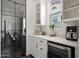 Bright kitchen featuring white cabinets, stainless steel appliances, and a glimpse into a home office at 20510 W White Rock Rd, Buckeye, AZ 85396