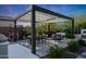 Enjoy outdoor dining with an expansive covered patio complete with a dining area and lounge seating at 20510 W White Rock Rd, Buckeye, AZ 85396