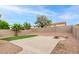 Spacious backyard with concrete patio, gravel landscaping, and a charming fire pit area for outdoor entertaining at 20929 N 37Th Way, Phoenix, AZ 85050