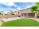 Home's backyard featuring a lawn, and covered patio at 20929 N 37Th Way, Phoenix, AZ 85050