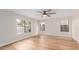Inviting bedroom with hardwood floors, a ceiling fan, and natural light at 20929 N 37Th Way, Phoenix, AZ 85050