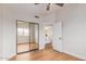 Bedroom featuring wood floors and a mirrored closet at 20929 N 37Th Way, Phoenix, AZ 85050