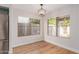 Cozy dining nook featuring hardwood floors, contemporary lighting, and backyard views at 20929 N 37Th Way, Phoenix, AZ 85050