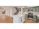 Modern kitchen with a center island, stainless steel appliances, and trendy green cabinetry at 20929 N 37Th Way, Phoenix, AZ 85050