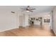 Spacious living area with hardwood floors seamlessly connects to the kitchen and staircase at 20929 N 37Th Way, Phoenix, AZ 85050