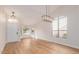 Bright, open living area with high ceilings, wood floors and modern light fixtures at 20929 N 37Th Way, Phoenix, AZ 85050