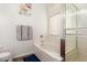 Clean bathroom features a white bathtub, glass enclosed shower, and neutral accents at 20977 N 84Th Ln, Peoria, AZ 85382