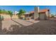 Private gravel backyard with a patio dining area, perfect for outdoor entertaining at 2154 E Forge Ave, Mesa, AZ 85204