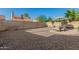 Low maintenance backyard with gravel landscaping, block fence and patio set at 2154 E Forge Ave, Mesa, AZ 85204
