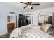 A well-appointed bedroom featuring an ensuite bathroom, neutral color scheme and TV at 2154 E Forge Ave, Mesa, AZ 85204