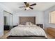 Comfortable bedroom featuring a large headboard, patterned bedding, and lots of natural light at 2154 E Forge Ave, Mesa, AZ 85204