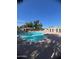 Large community pool offers ample space for swimming and recreation in a refreshing setting at 2154 E Forge Ave, Mesa, AZ 85204