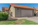 Home exterior showcases a clay tile roof, two-car garage, and manicured lawn at 2154 E Forge Ave, Mesa, AZ 85204