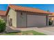 Home exterior showcases a clay tile roof, two-car garage, and manicured lawn at 2154 E Forge Ave, Mesa, AZ 85204
