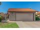Attractive home with a tile roof, a two-car garage, and low-maintenance landscaping at 2154 E Forge Ave, Mesa, AZ 85204