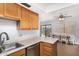 Functional kitchen space with an attached dining area and backyard access at 2154 E Forge Ave, Mesa, AZ 85204