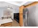 Kitchen and dining area featuring modern appliances and a breakfast table at 2154 E Forge Ave, Mesa, AZ 85204