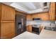 Well-lit kitchen featuring stainless steel appliances and ample counter space at 2154 E Forge Ave, Mesa, AZ 85204