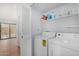 Convenient laundry room equipped with washer, dryer, and storage shelves at 2154 E Forge Ave, Mesa, AZ 85204