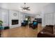 Bright living room with fireplace, tile floors, and sliding doors to the backyard at 2154 E Forge Ave, Mesa, AZ 85204