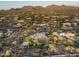 Home surrounded by desert landscape and mountain views at 22022 N Calle Royale Dr, Scottsdale, AZ 85255