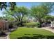Expansive backyard with pristine landscaping and mature trees at 22022 N Calle Royale Dr, Scottsdale, AZ 85255