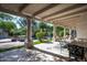 Inviting covered patio overlooking a pool, waterfall feature, and landscaped backyard at 22022 N Calle Royale Dr, Scottsdale, AZ 85255