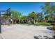 Full basketball court with mature landscaping and home in background at 22022 N Calle Royale Dr, Scottsdale, AZ 85255