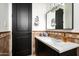 Stylish bathroom featuring a marble countertop, framed mirror, and modern fixtures at 22022 N Calle Royale Dr, Scottsdale, AZ 85255