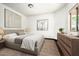 Well-lit bedroom featuring a comfortable bed, stylish dresser, and neutral decor enhancing a relaxing atmosphere at 22022 N Calle Royale Dr, Scottsdale, AZ 85255