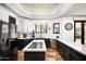 Modern kitchen with stainless steel appliances, white backsplash, and dual-tone cabinetry at 22022 N Calle Royale Dr, Scottsdale, AZ 85255