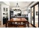 Eat in kitchen featuring a modern chandelier, seating for 6, and backyard access at 22022 N Calle Royale Dr, Scottsdale, AZ 85255