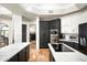 Modern kitchen with stainless steel appliances, white backsplash, and dual-tone cabinetry at 22022 N Calle Royale Dr, Scottsdale, AZ 85255