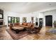 Bright living room with large sectional couch, fireplace, and backyard access at 22022 N Calle Royale Dr, Scottsdale, AZ 85255