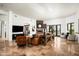 Spacious living room with stone fireplace, neutral walls, and direct access to the backyard at 22022 N Calle Royale Dr, Scottsdale, AZ 85255