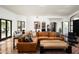 Cozy living room featuring comfortable seating, backyard access, and tile floors at 22022 N Calle Royale Dr, Scottsdale, AZ 85255